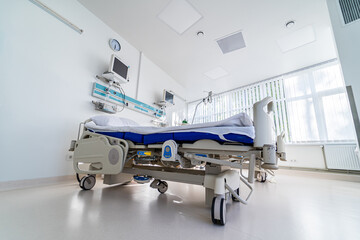 Modern medical bed and a special device in the modern ward. Medical chamber. First aid. Reanimation