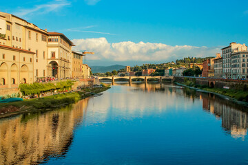 Fototapeta na wymiar A view from above of the bridges of the Arno River in Florence. The ancient bridge of Ponte Vecchio
