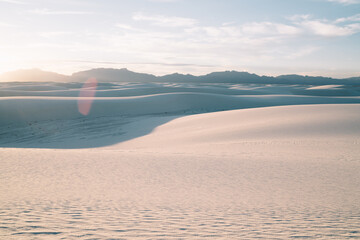 Landscape of white sand hills in sunlight