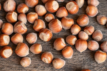 Hazelnuts on a wooden background
