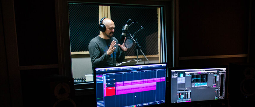 Expressive man in recording studio.