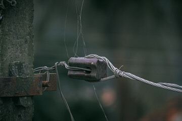 A high voltage stay insulator over which high voltage line is connected.