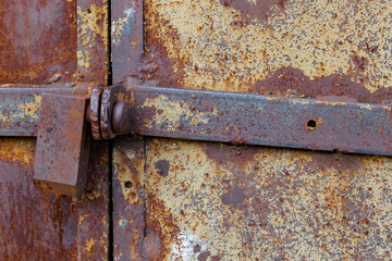 Old door with an old lock. Old padlock.