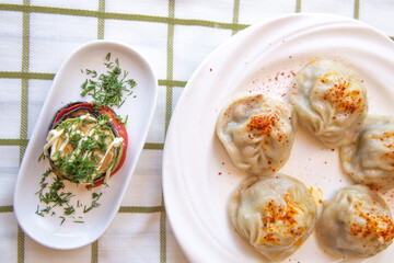  manti on a white table, top view
