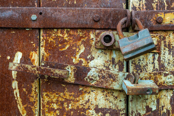 Old door with an old lock. Old padlock.
