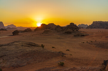 Fototapeta na wymiar Vintage photos from archive. Jordan. Sunset in Wadi Rum desert. Martian landscapes in lifeless desert. Red rocks and red sand.