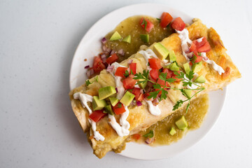 Honey lime chicken enchiladas with toppings
