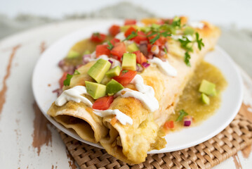 Honey lime chicken enchiladas with toppings