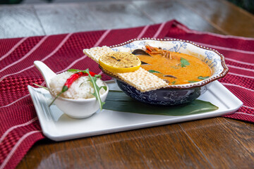  tom yum soup on a wooden table