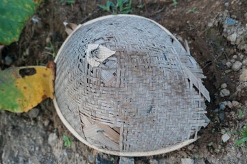 The traditional hat made of woven bamboo is called the Caping.