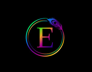 Obraz premium E Letter Decorated With Hologram Color Peacock Feather. Circle Badge With Peacock Feather.