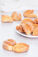 Tasty baked butter sugar cookies on white background.