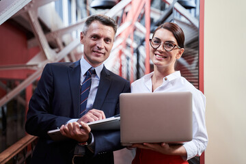 Waist up portrait of confident business people in formal wear