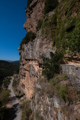 It was constructed in 1212 in the honor of the Assumption of Virgin Mary. The monastery of Kipina, just outside the village of Kalarrites, seems to be a part of the rock inside which it is built.