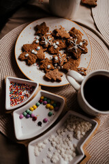 Homemade cookies in New Year's dishes with a cup of coffee