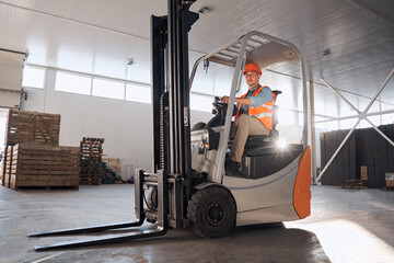 Forklift operator in warehouse