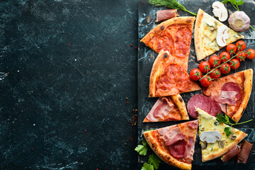 Delicious pizza. Assortment of pizza pieces. Top view. Free space for your text.