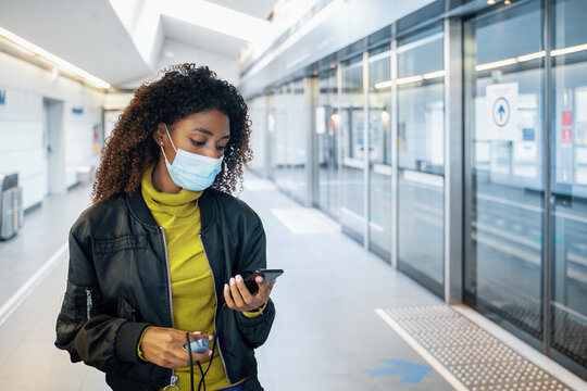 Black Woman Traveling On Public Transport And Wearing Face Mask During Coronavirus Pandemic