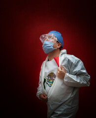 Hero surgeon, masked looking up at the sky, carries the Mexican flag. Hope and fight. Tired doctors