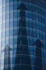 Fototapeta premium Business investment growth concept with abstract arrows on building