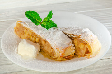 Hot fruit strudel with apple spices and a slice of butter