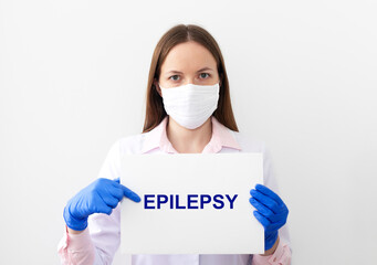 Doctor with word Epilepsy on paper board. Medical concept