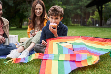 Happy family having picnic outside the city