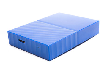 Blue external hard drive 2 terabytes with usb 3.0 port and micro-b wire for computer data storage backup isolated on white background.