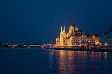 Hungarian Parliament and bridge in Budapest. Night illumination at blue background. Amazing landmark in Europe, Hungary.