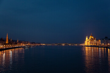 Naklejka na ściany i meble Hungarian Parliament and bridge in Budapest. Night illumination. Amazing landmark in Europe, Hungary.