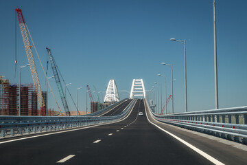 Fototapeta premium Cars go on the Crimean automobile bridge connecting the banks of the Kerch Strait: Taman and Kerch, Crimea. Russia