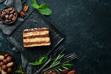 A piece of sweet chocolate cream cake. Top view.