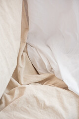 Creased bedding cloth. Textile background