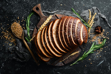 Sliced black bread. Baking from rye and flour. Top view.