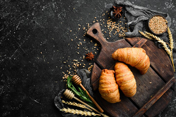 Fresh French croissants with chocolate. Baking from rye and flour. Top view. Rustic style.