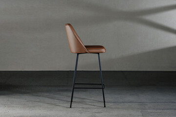 Closeup of an armless chair with a concave back, loft-style furniture
