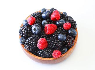 Bowl of fresh fruit. Blackberries,raspberries,blueberries on a bowl. Healthy breakfast. Vegan sweet food.