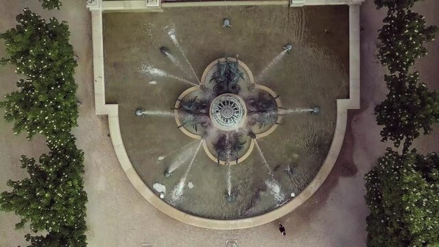 Aerial drone footage from Paris filmed in luxembourg gardens at Avenue de L'observatoire.Overhead video clip of famous Fontaine de L'observatoire at Jardin des Grands Explorateurs