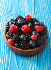 Bowl of fresh fruit. Blackberries,raspberries,blueberries on a bowl. Healthy breakfast.