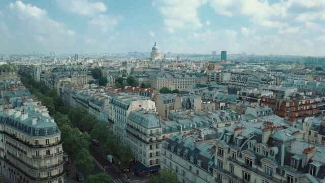 Aerial drone footage from Paris filmed in luxembourg gardens at Avenue Observatoire. Panoramic video clip of Parisian central district. Classic old French houses filmed from above