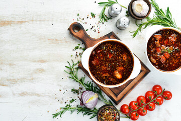 Bograch. Vegetable soup with meat and hot chili peppers. Hungarian traditional food. Top view. Free space for your text.