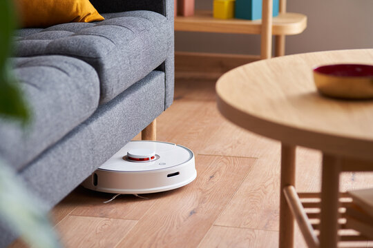 Robotic vacuum cleaner under sofa
