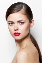 Fototapeta premium Beautiful woman red lips bared shoulders long hair 