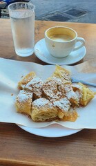 Bougatsa with espresso, usual breakfast in Greece.