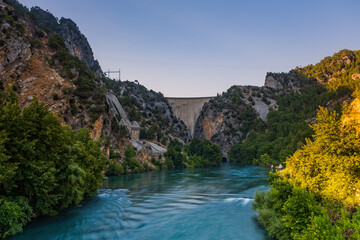 Fototapeta na wymiar Side, Turkey, July 2020: Dam on the Manavgat river near the city of Side in Turkey. Long exposure picture.
