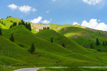 Obraz premium Mountain landscape along the road to Pordoi pass, Dolomites