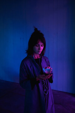 Neon light portrait young woman