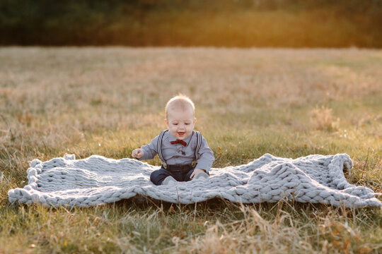 Baby Boy on a blanket in a field
