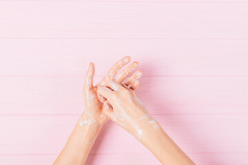 Top view female hands in the process of step-by-step procedure of washing hands