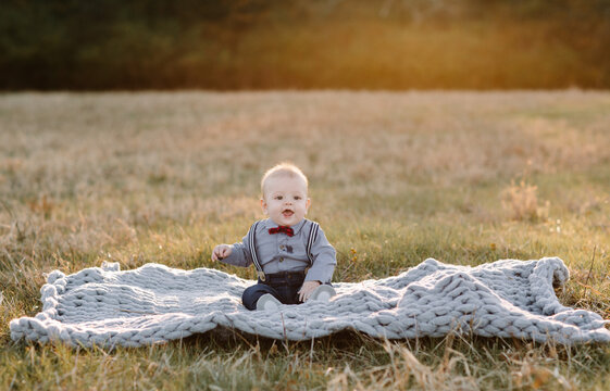Baby Boy on a blanket in a field